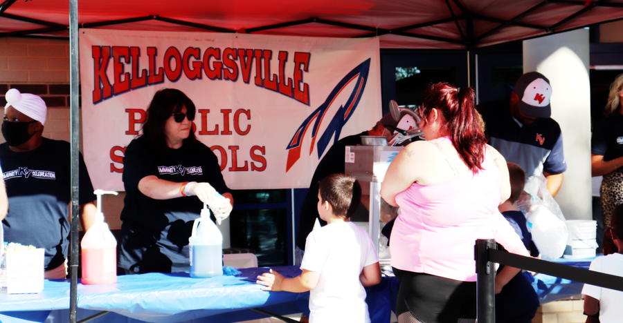 Kelloggsville Board of Education serving the community snowcones (as their tradition) at the KV Community Celebration 2021.