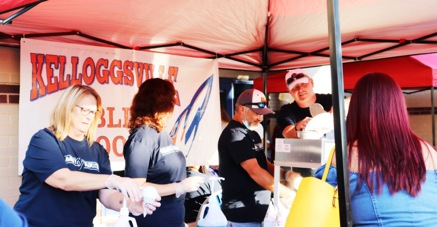 Kelloggsville Board of Education serving the community snowcones (as their tradition) at the KV Community Celebration 2021.
